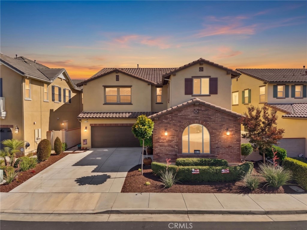 31749 Country View Road Temecula, CA 92591 - Photo 1 of 68 a front view of a house with a garden