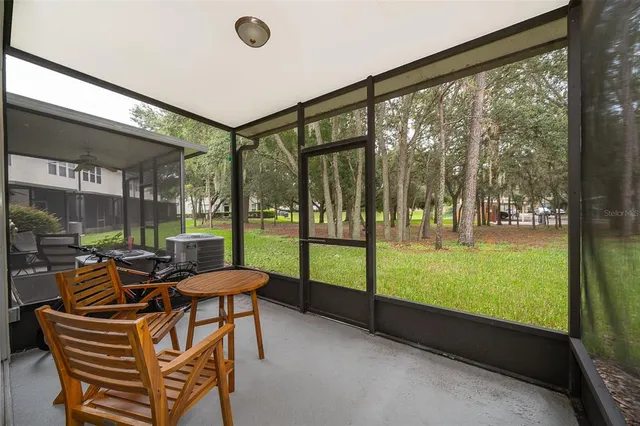 a building outdoor space with patio furniture and garden