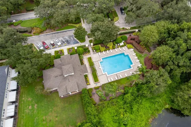 an aerial view of residential house with outdoor space and swimming pool