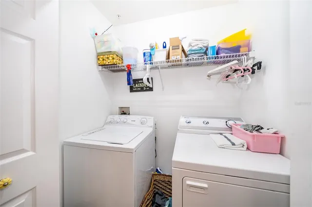 a utility room with dryer and washer
