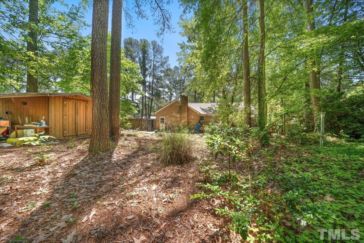 608 Brighton Road Durham, NC 27707 - Photo 21 of 26 a backyard of a house with lots of green space