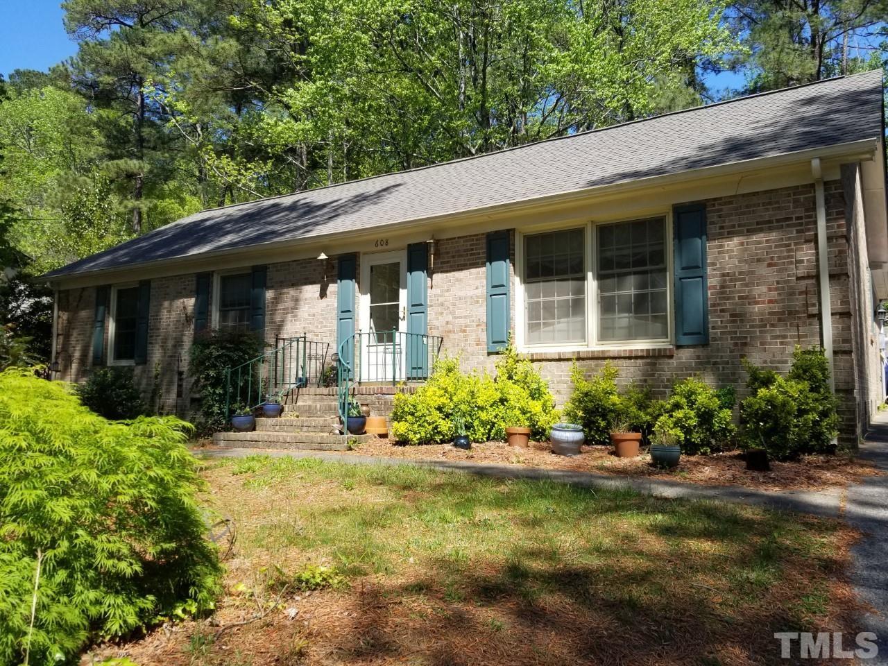 608 Brighton Road Durham, NC 27707 - Photo 25 of 26 a front view of a house with a yard