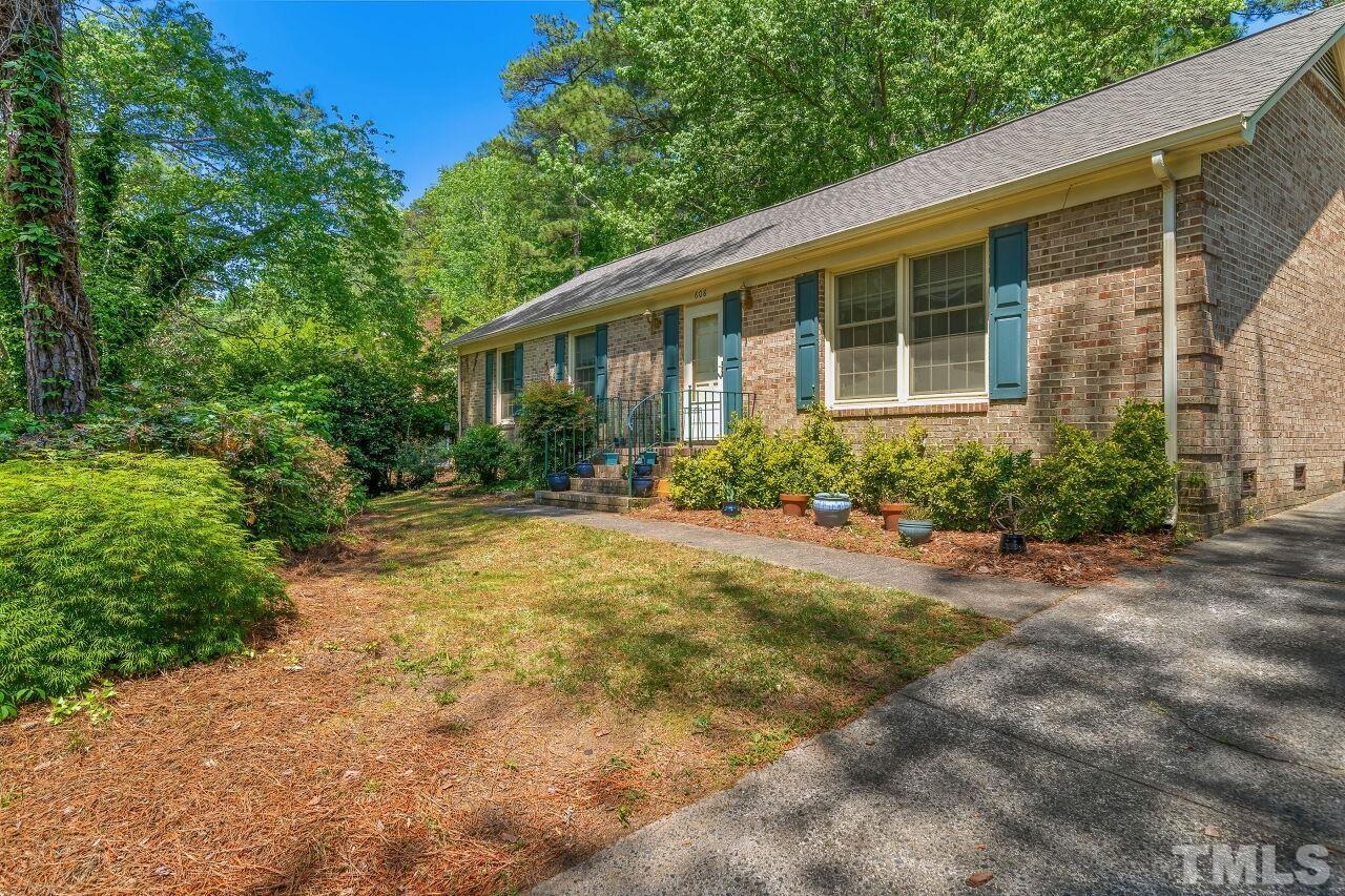 608 Brighton Road Durham, NC 27707 - Photo 3 of 26 a front view of a house with garden
