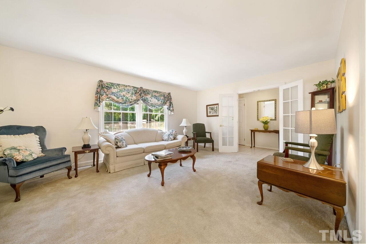 608 Brighton Road Durham, NC 27707 - Photo 5 of 26 a living room with furniture and a large window
