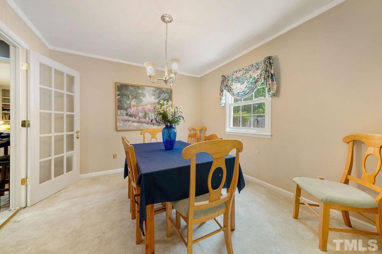 608 Brighton Road Durham, NC 27707 - Photo 6 of 26 a view of a dining room with furniture window and outside view