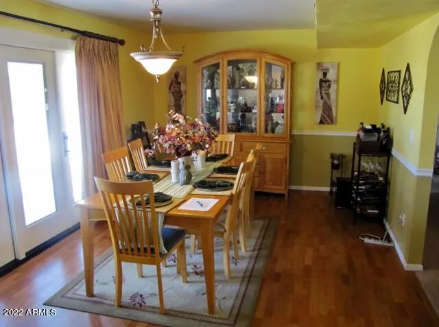 a very nice looking dining room with a table and chairs