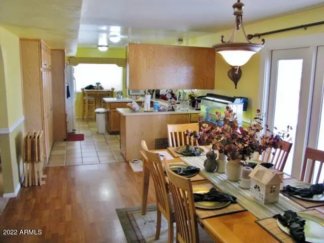 a view of a refrigerator in kitchen
