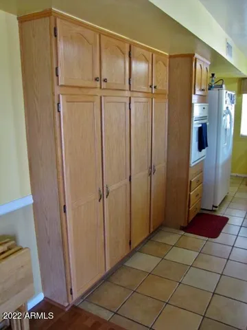a kitchen with a sink a stove and cabinets