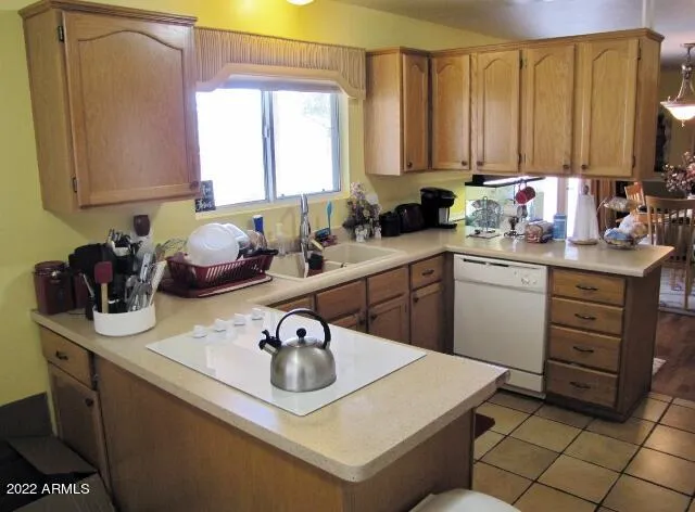 a kitchen with stainless steel appliances a refrigerator and a stove