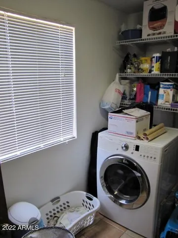 a view of hallway with furniture and a shower