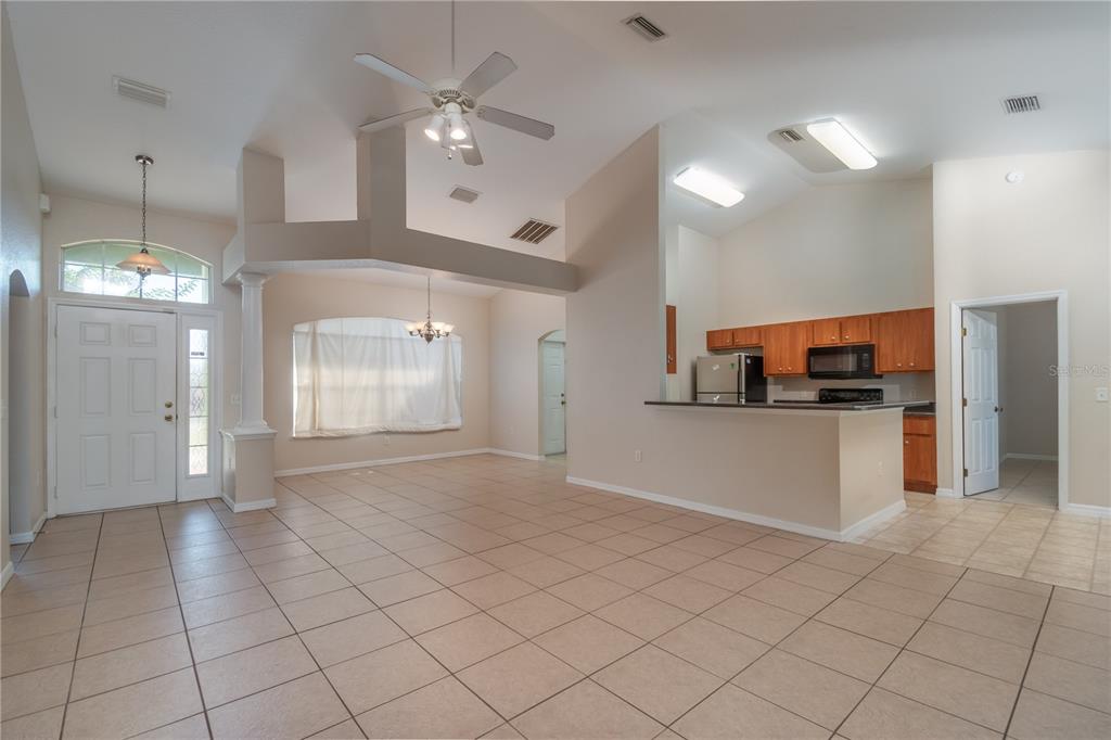6375 Southwest 63rd Street Ocala, FL 34474 - Photo 12 of 35 a view of a kitchen with cabinet and refrigerator