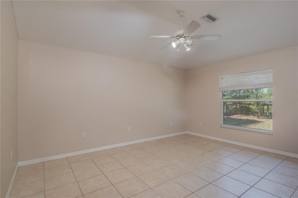 6375 Southwest 63rd Street Ocala, FL 34474 - Photo 17 of 35 an empty room with a window