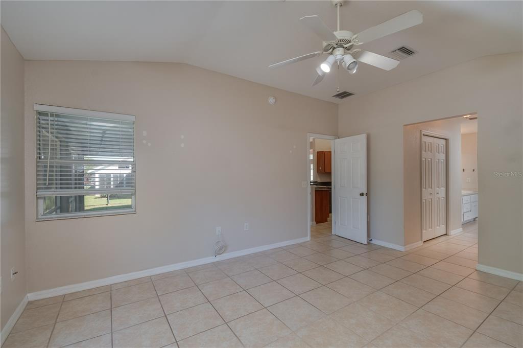 6375 Southwest 63rd Street Ocala, FL 34474 - Photo 18 of 35 an empty room with fan and windows