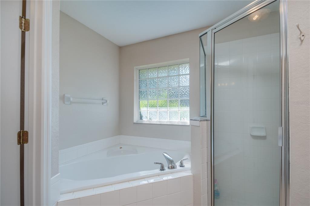 6375 Southwest 63rd Street Ocala, FL 34474 - Photo 22 of 35 a white bath tub sitting next to a window