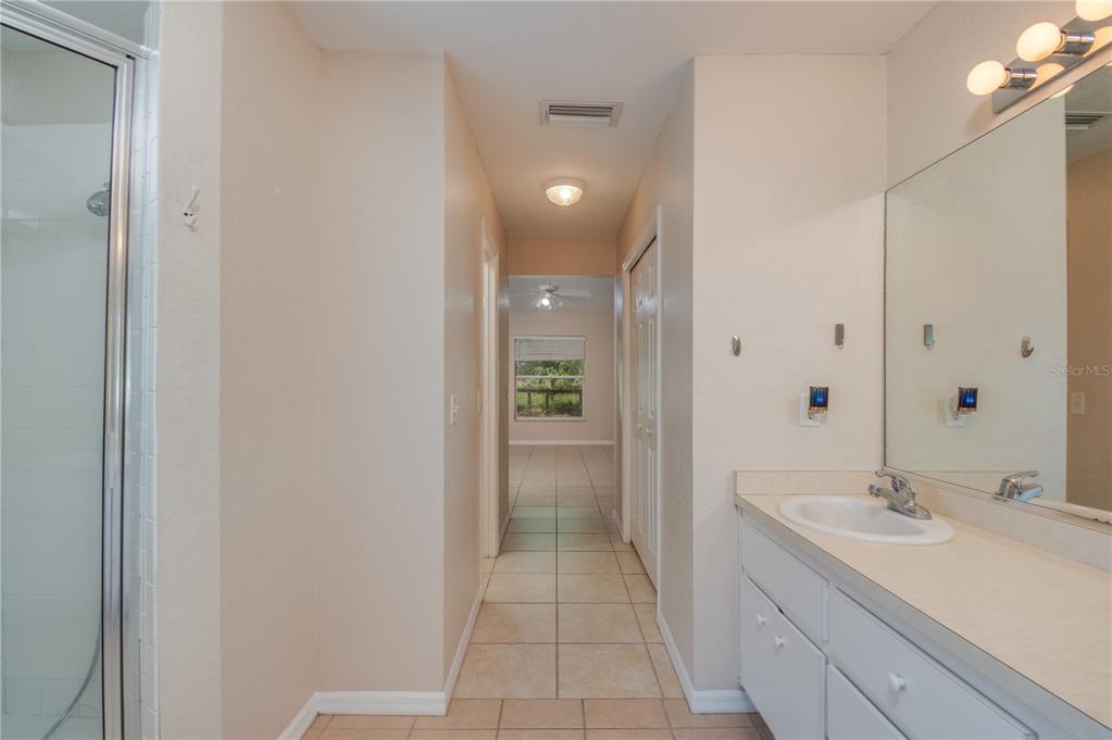6375 Southwest 63rd Street Ocala, FL 34474 - Photo 23 of 35 a bathroom with a sink a shower and a mirror