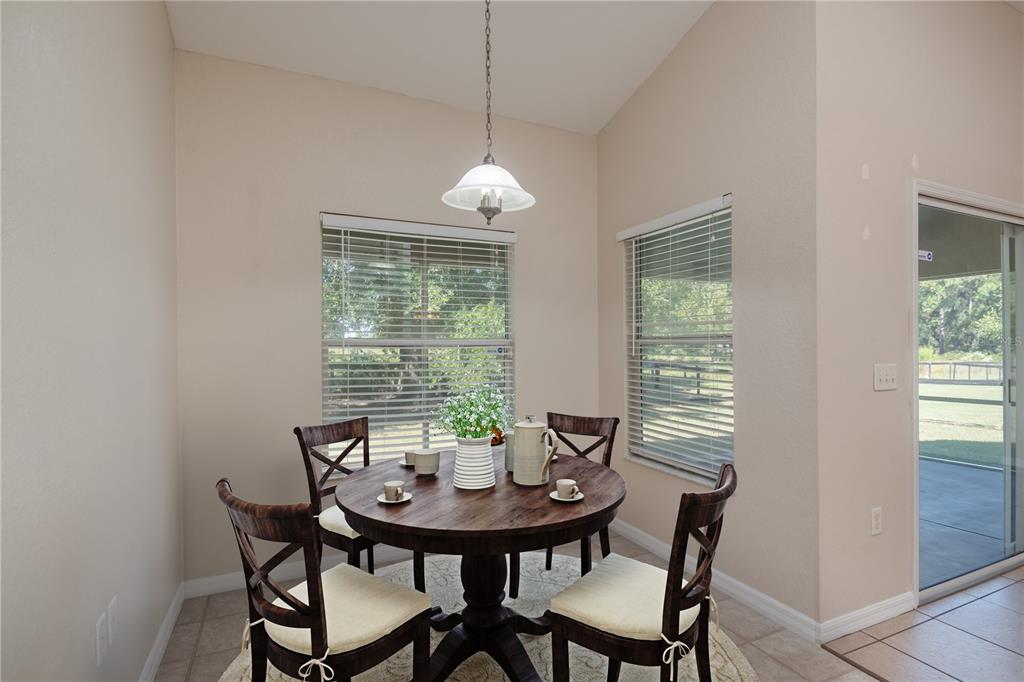 6375 Southwest 63rd Street Ocala, FL 34474 - Photo 6 of 35 a view of a dining room with furniture window and outside view