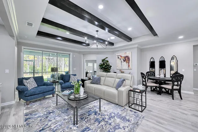 a kitchen with stainless steel appliances granite countertop a shelf and a microwave