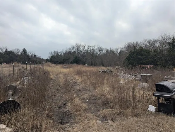 a view of a lake with houses in back