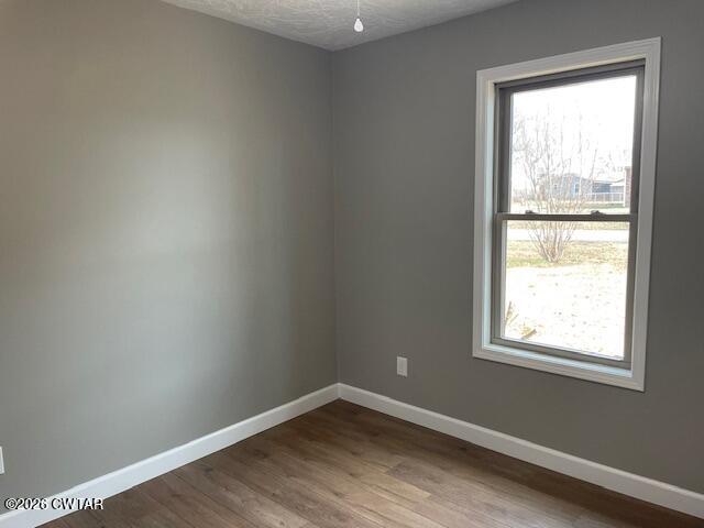 845 Gum Street Union City, TN 38261 - Photo 15 of 17 a view of an empty room with wooden floor and a window