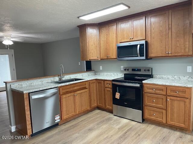 845 Gum Street Union City, TN 38261 - Photo 6 of 17 a kitchen with stainless steel appliances granite countertop a stove a sink and a microwave