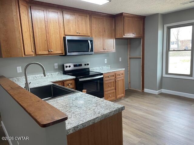 845 Gum Street Union City, TN 38261 - Photo 7 of 17 a kitchen with stainless steel appliances granite countertop a sink stove and microwave