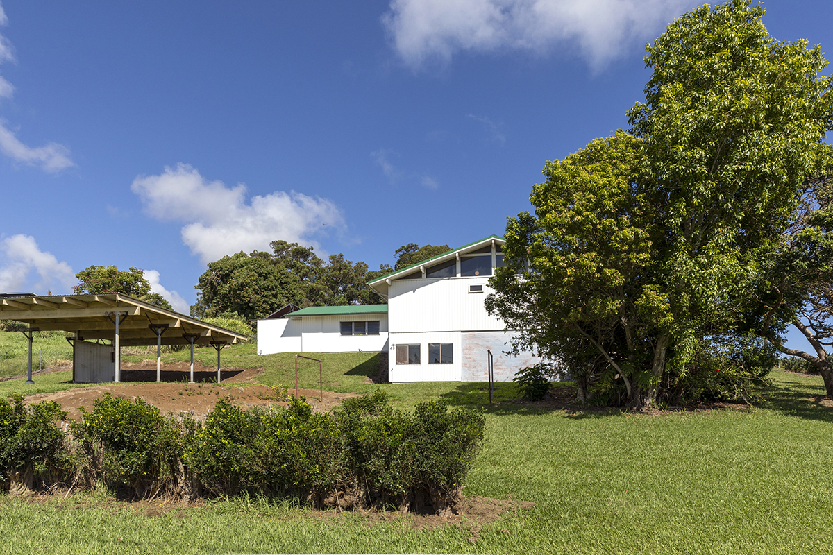 45-3303 Milo Street Honokaa, HI 96727 - Photo 26 of 28 a front view of a house with a yard