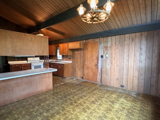 45-3303 Milo Street Honokaa, HI 96727 - Photo 4 of 28 a kitchen with stainless steel appliances granite countertop a stove a sink and a microwave