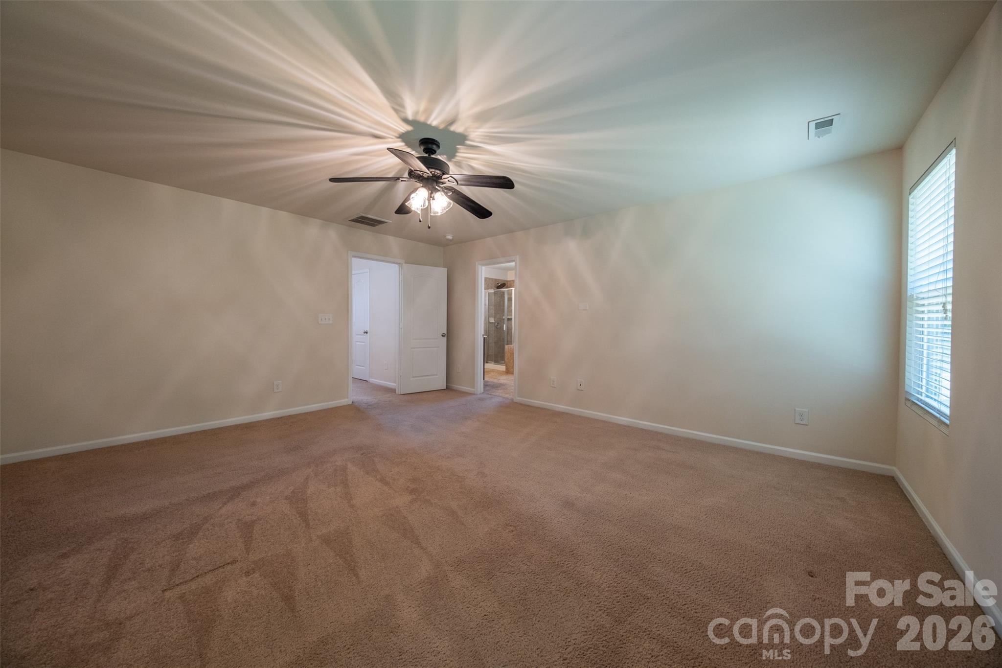 3006 Houndscroft Road Indian Trail, NC 28079 - Photo 34 of 39 an empty room with windows and fan