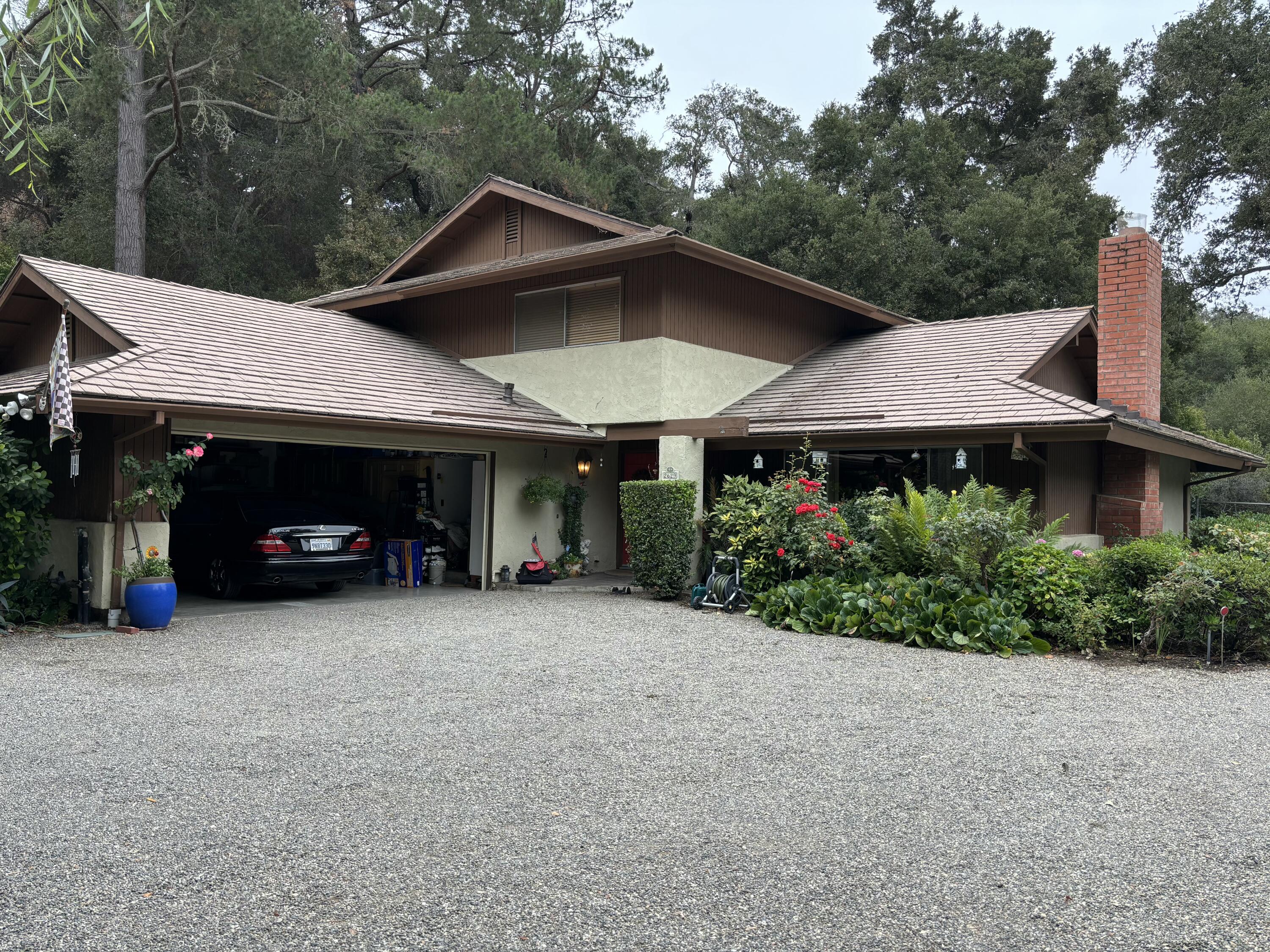 2629 Quail Valley Road Solvang, CA 93463 - Photo 1 of 2 a view of a house with garden and trees