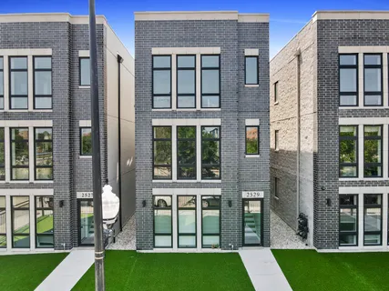 a view of house with a yard