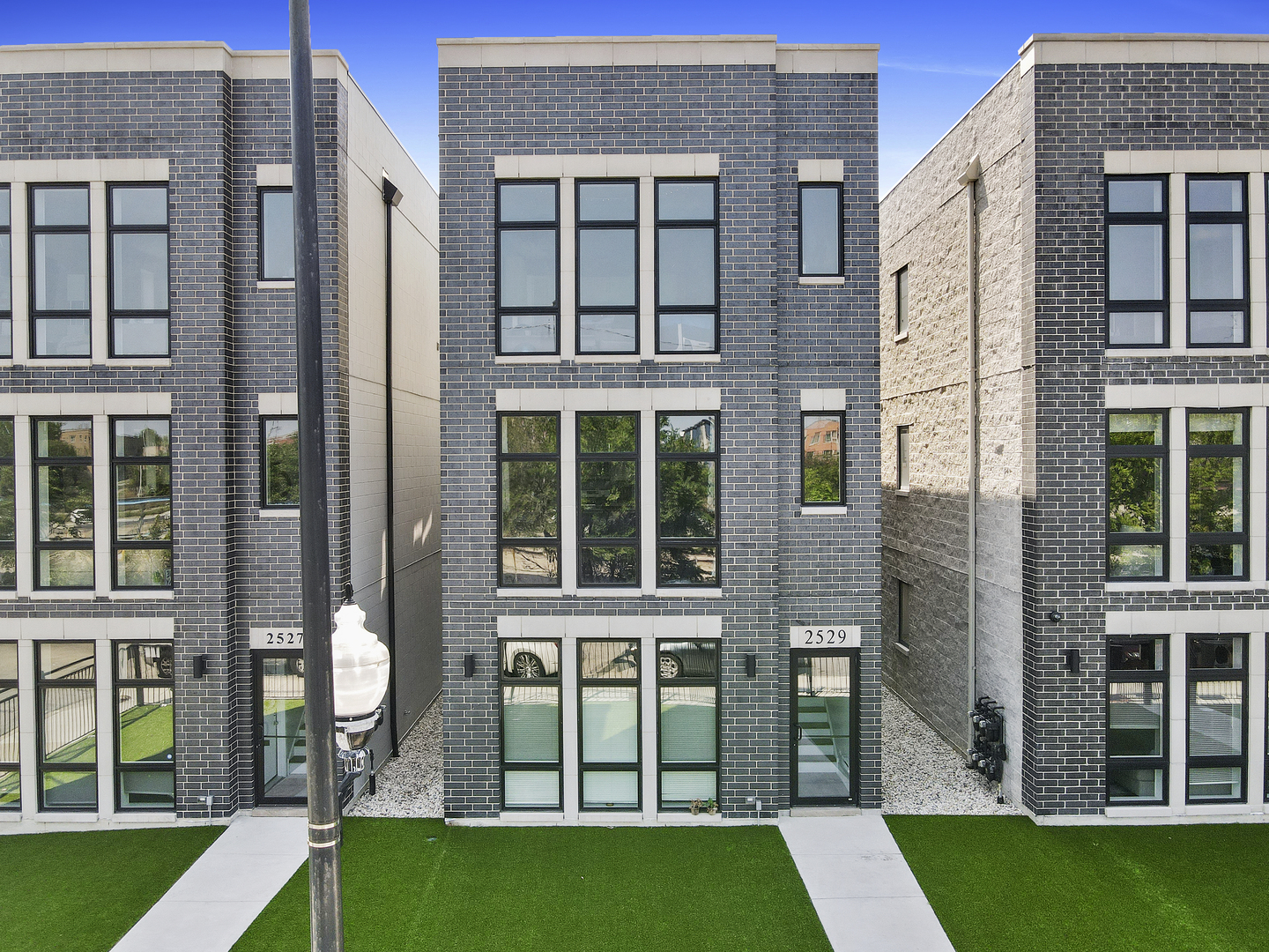 a view of house with a yard