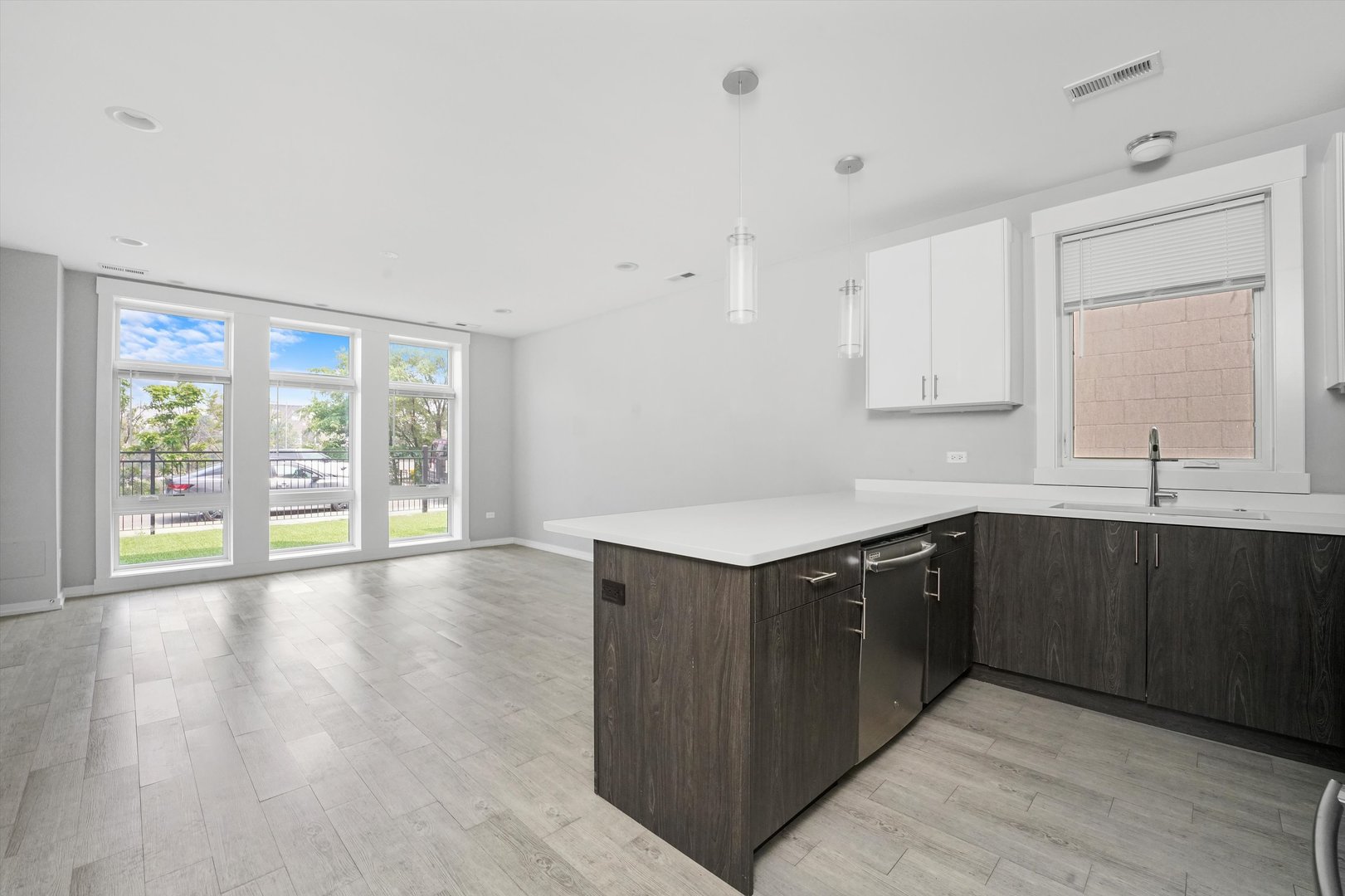 2529 West Congress Parkway, Unit 1 Chicago, IL 60612 - Photo 2 of 12 a kitchen with stainless steel appliances granite countertop a sink and wooden cabinets