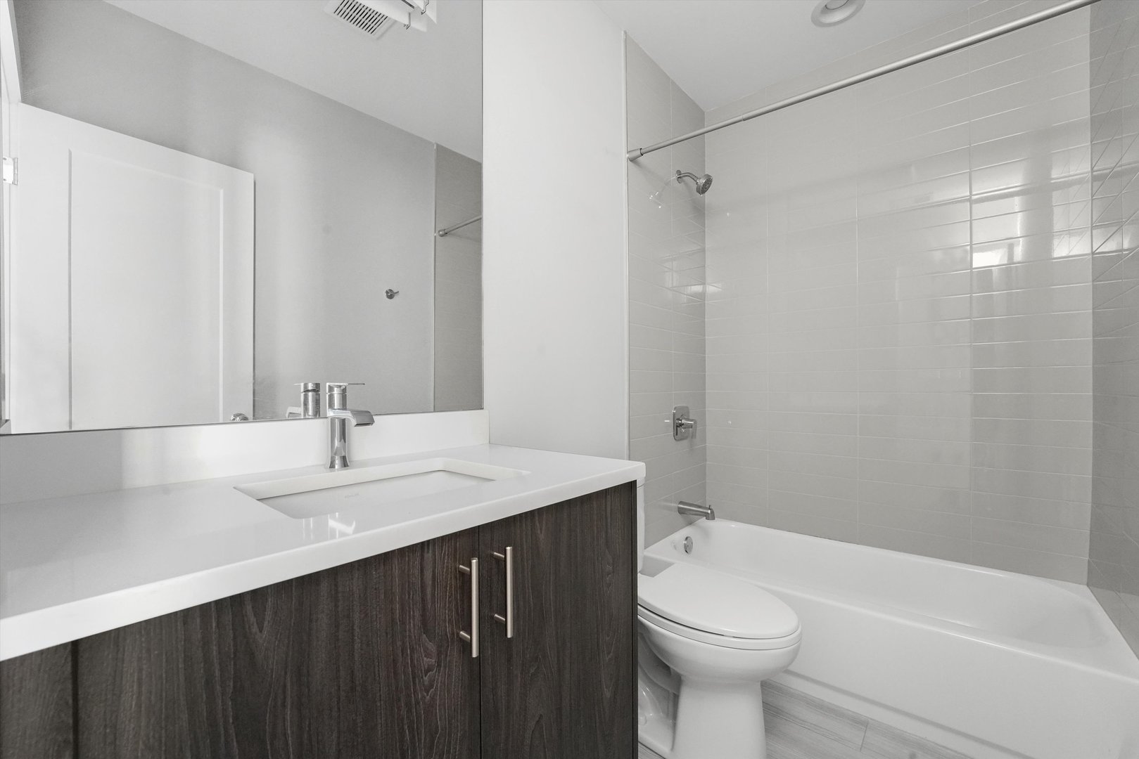 2529 West Congress Parkway, Unit 1 Chicago, IL 60612 - Photo 5 of 12 a bathroom with a sink a toilet and shower