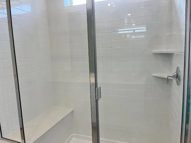a bathroom with a double vanity sink and a mirror