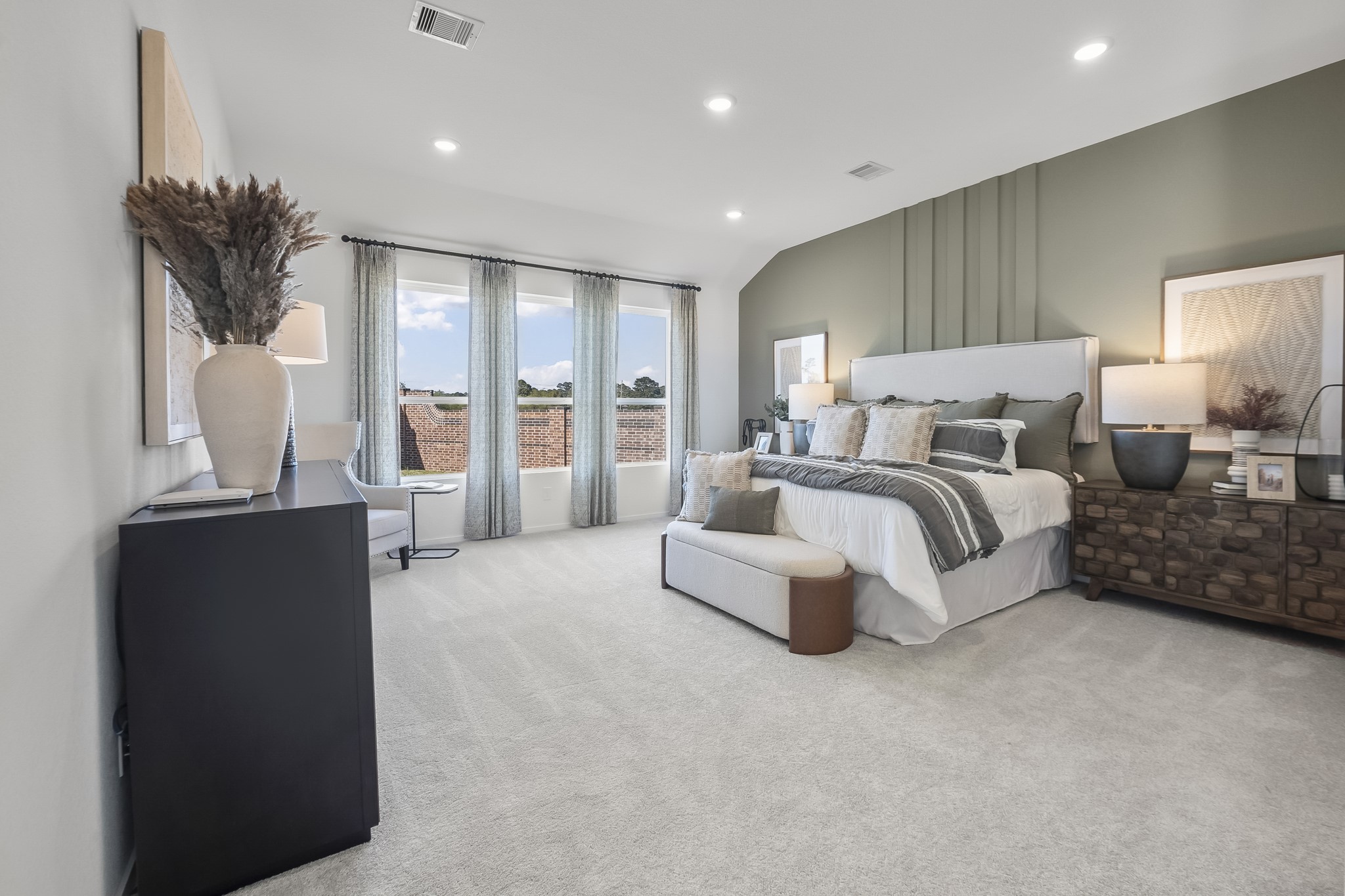 2134 Mosaic Vly Court Angleton, TX 77515 - Photo 8 of 27 a spacious bedroom with a bed and a large window