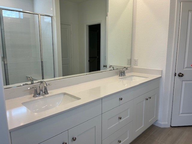 2134 Mosaic Vly Court Angleton, TX 77515 - Photo 19 of 27 a bathroom with a sink and a mirror