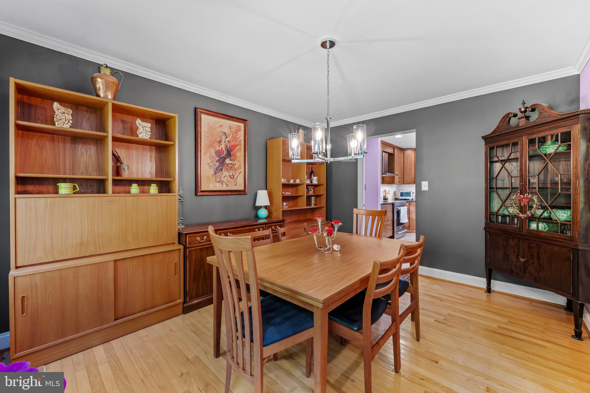 5026 Mt Carmel Road Hampstead, MD 21074 - Photo 11 of 57 a view of a dining room with furniture window and wooden floor
