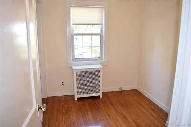 a bathroom with a granite countertop sink a toilet and bathtub