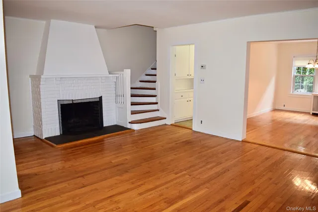 a kitchen with a refrigerator stove and white cabinets