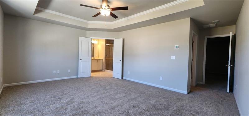 1476 Fern Ridge Lane Norcross, GA 30093 - Photo 14 of 19 an empty room with closet and a ceiling fan