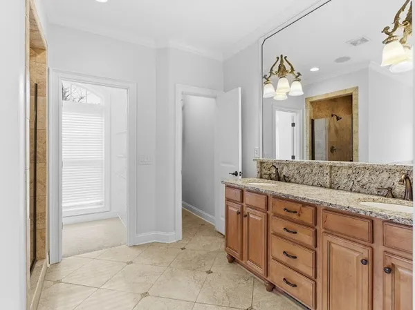 a view of an empty room with a fireplace and a window