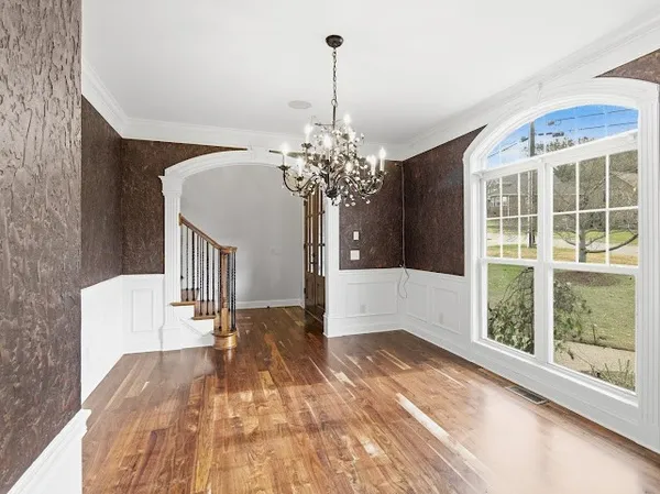 a living room with furniture a projector and a flat screen tv