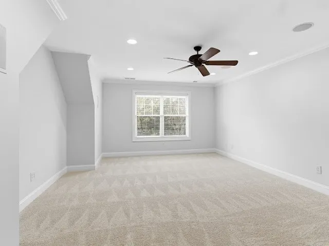 a view of a patio with a table and chairs under an umbrella