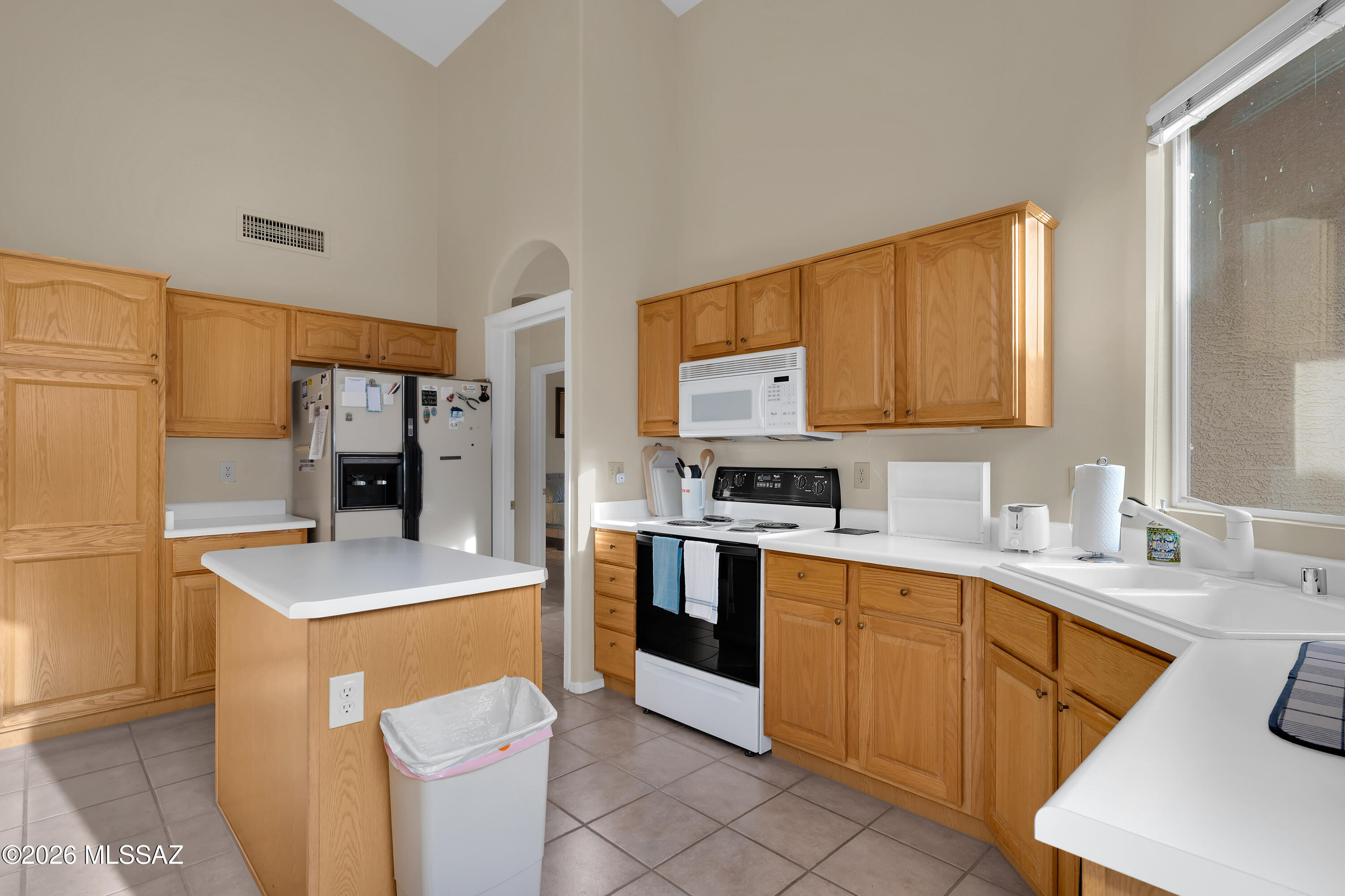 64351 East Wind Ridge Circle Tucson, AZ 85739 - Photo 16 of 41 a kitchen with stainless steel appliances granite countertop a sink dishwasher stove top oven and refrigerator
