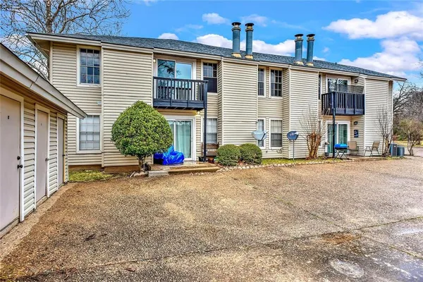 a view of a house with a yard and garage