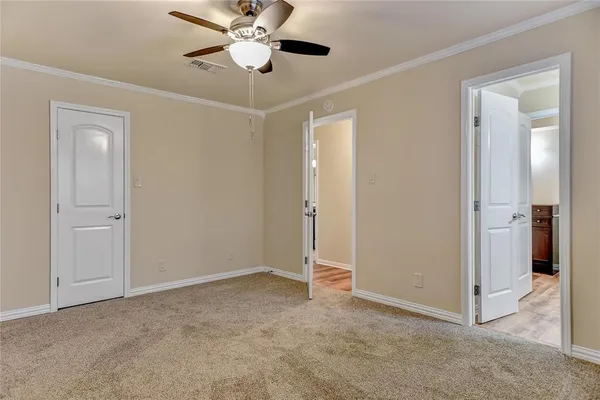 a view of an empty room and closet area