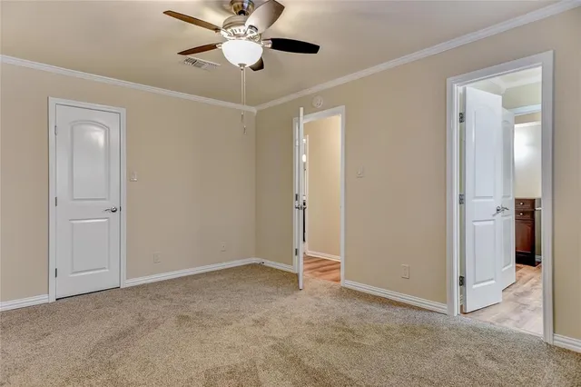 a view of an empty room and closet area