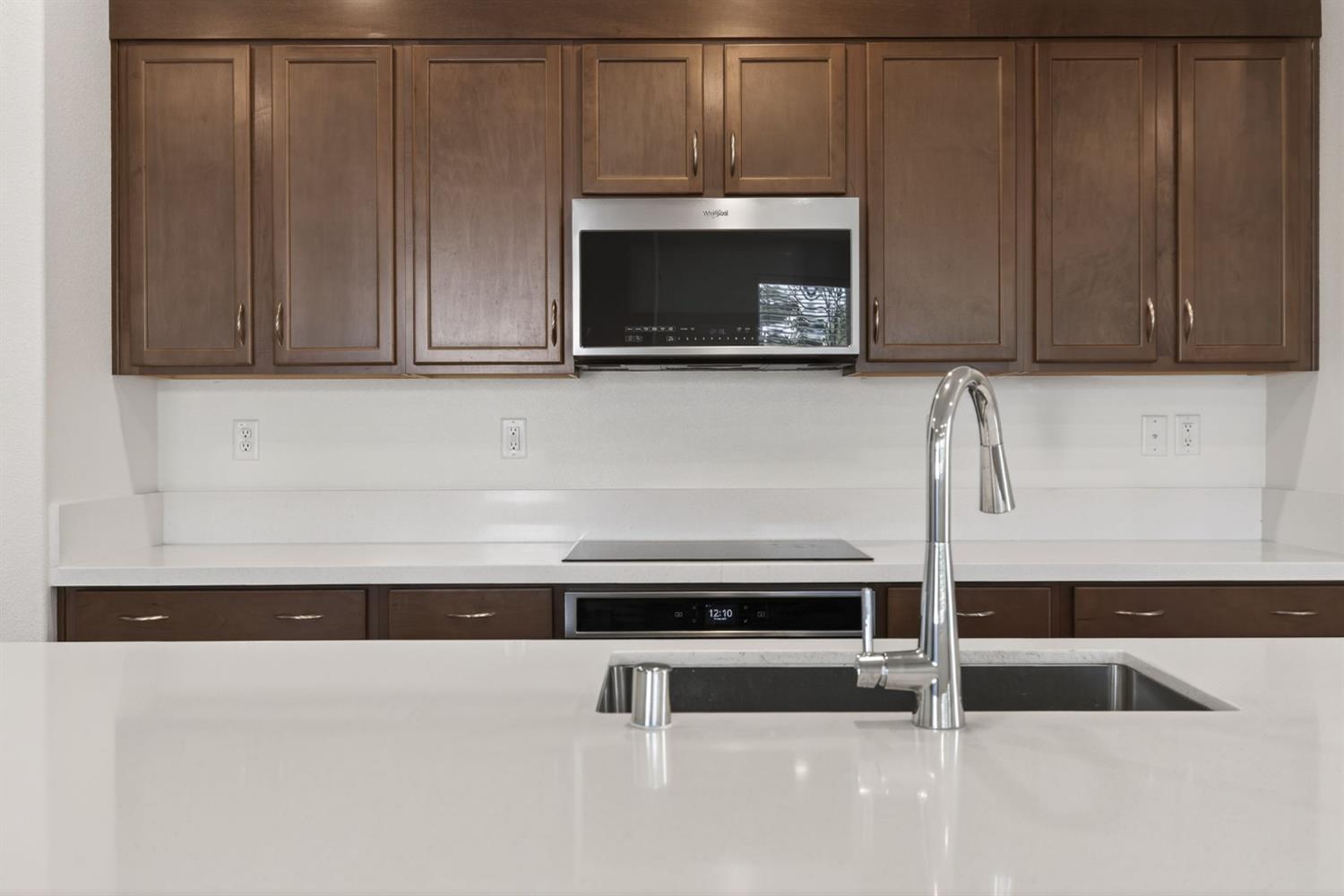 3080 Windwalker Walk Sacramento, CA 95833 - Photo 12 of 61 a kitchen with granite countertop a cabinets and a microwave oven
