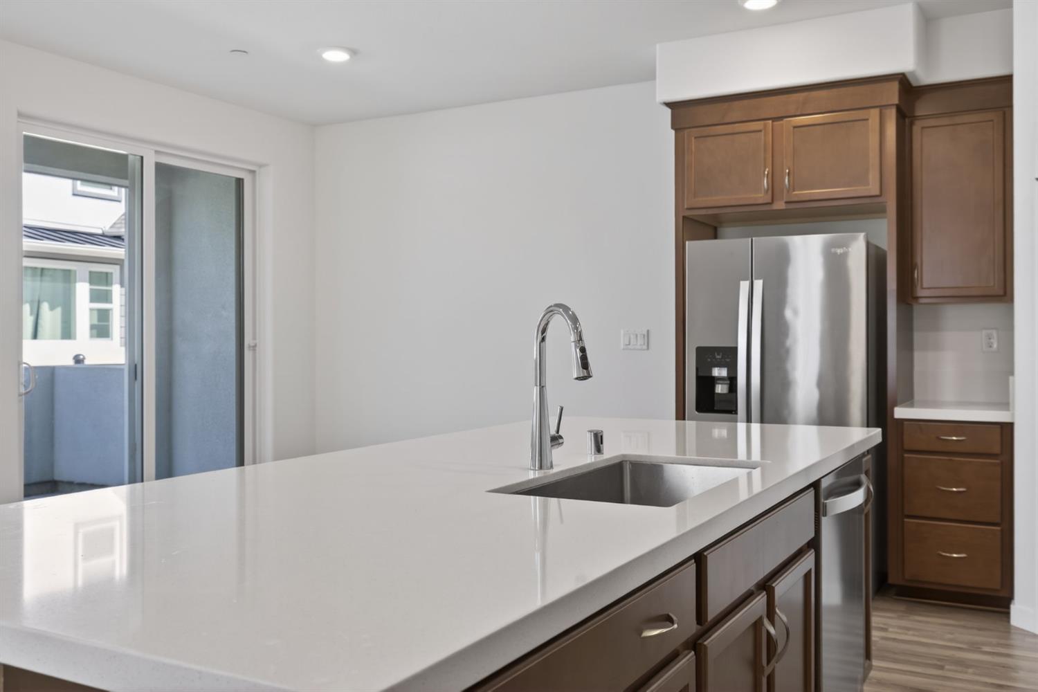 3080 Windwalker Walk Sacramento, CA 95833 - Photo 13 of 61 a kitchen with a sink and a refrigerator