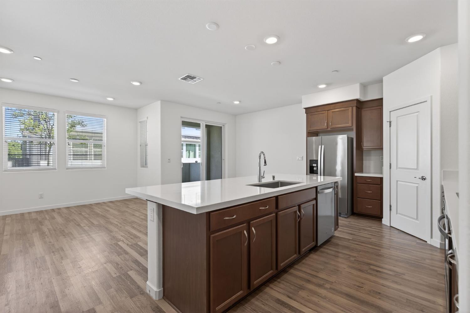 3080 Windwalker Walk Sacramento, CA 95833 - Photo 14 of 61 a kitchen with sink and refrigerator